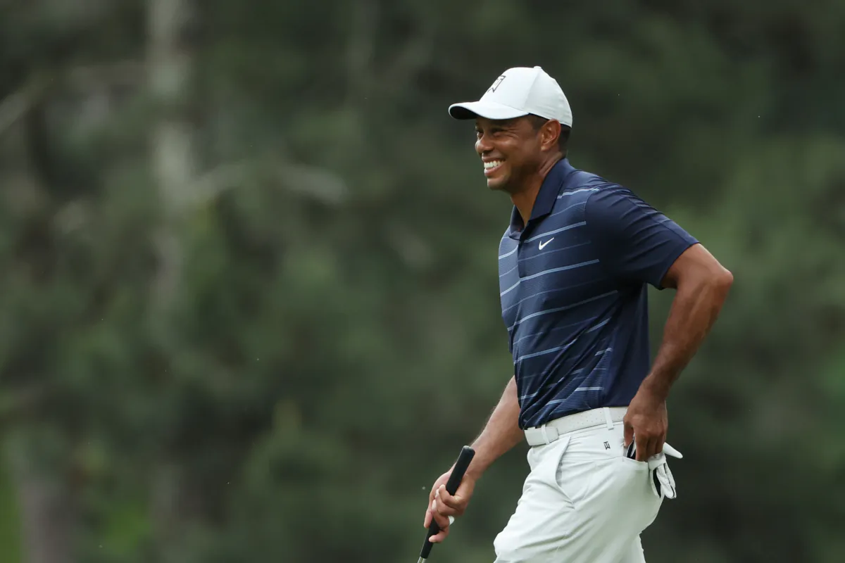 Tiger Woods of the United States laughs on the third green during the second round of the 2023 Masters Tournament at Augusta National Golf Club in Augusta, Georgia, on April 7, 2023. (Patrick Smith/Getty Images)