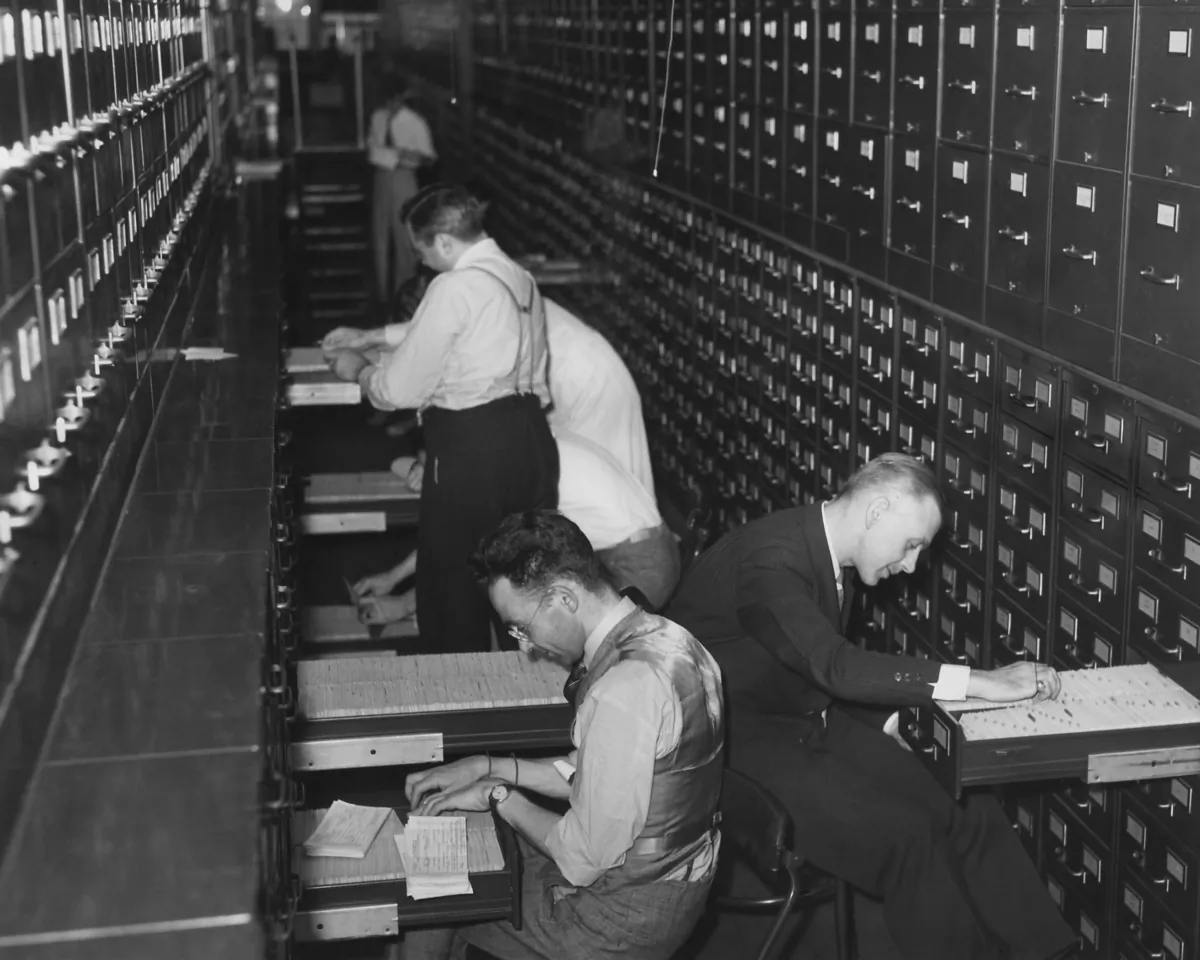 Government employees at the new Social Security Administration file citizens' applications for social security account numbers. Circa 1937. (Everett Collection/Shutterstock)