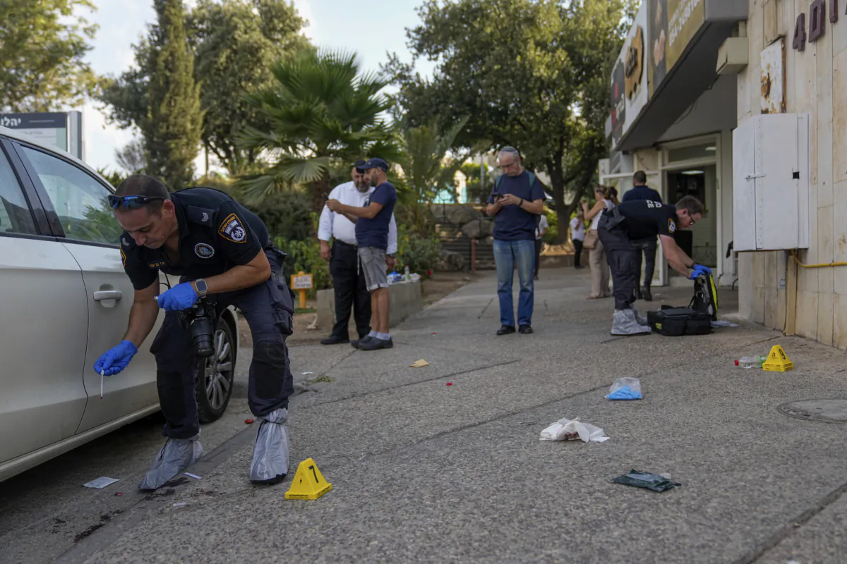 Israeli police inspect the site of a shooting attack in the West Bank Israeli settlement of Ma'ale Adumim, on Aug. 1, 2023. (Ohad Zwigenberg/AP Photo)