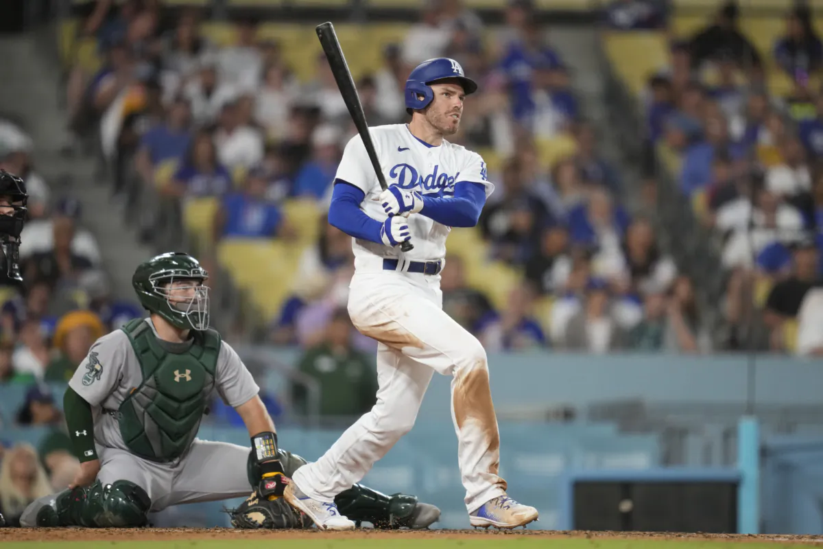 Los Angeles Dodgers' Freddie Freeman (5) doubles during the third inning of a baseball game against the Oakland Athletics in Los Angeles on Aug. 2, 2023. (Ashley Landis/AP Photo)