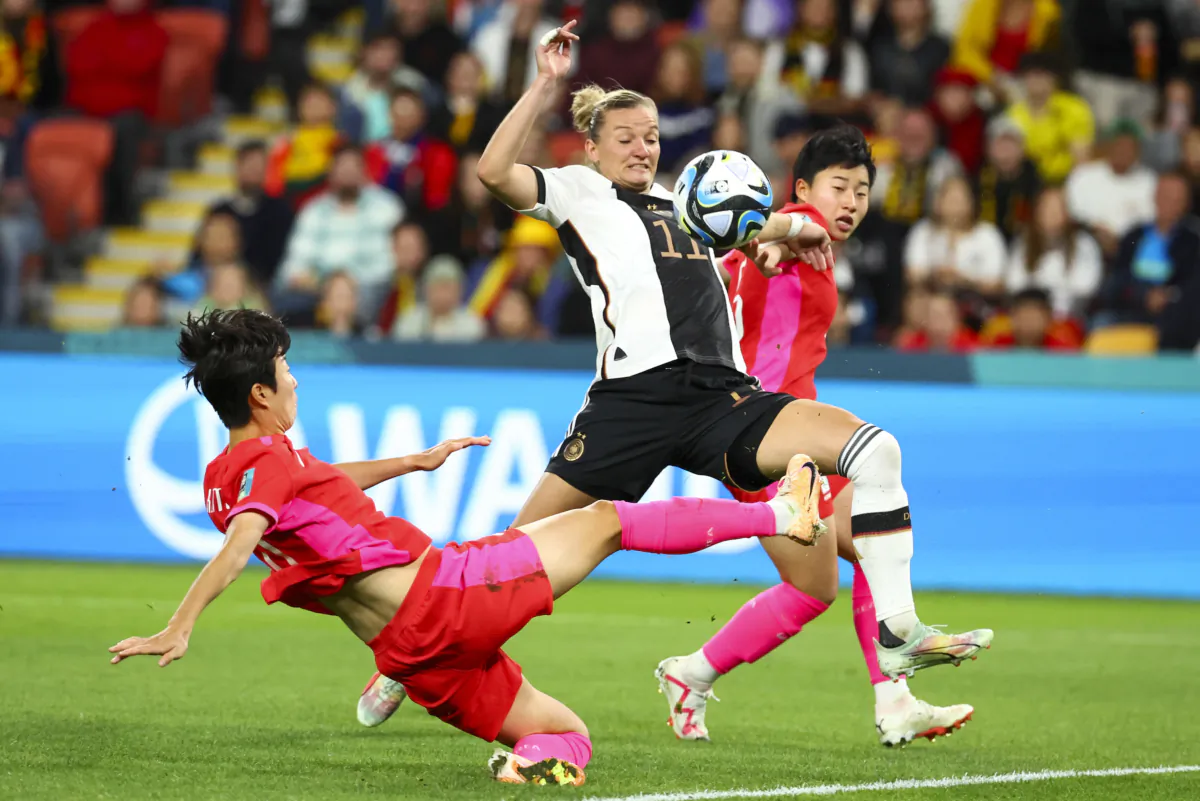 South Korea's Kim Hye-ri, left, kicks the ball clear of Germany's Alexandra Popp during the Women's World Cup Group H soccer match between South Korea and Germany in Brisbane, Australia, on Aug. 3, 2023. (Tertius Pickard/AP Photo)