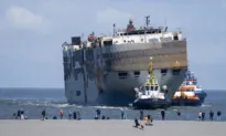 A Car-Carrying Ship That Burned for a Week on the North Sea Is Towed to a Dutch Port for Salvaging