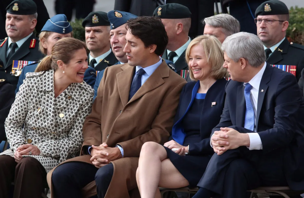 (L–R) Sophie Grégoire Trudeau, prime minister-designate Justin Trudeau, Laureen Harper, and then-prime minister Stephen Harper prior to a ceremony at the National War Memorial on Parliament Hill in Ottawa on Oct. 22, 2015. (Fred Chartrand/The Canadian Press)