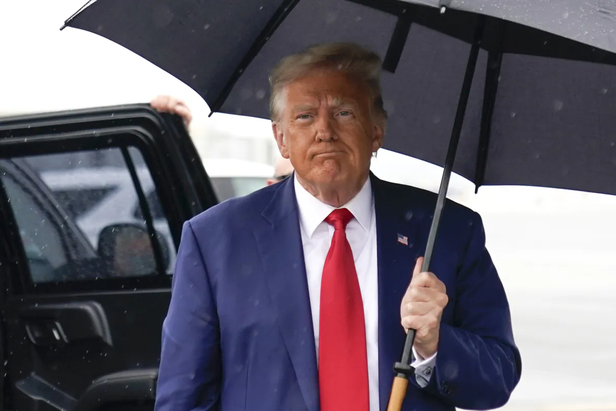 Former President Donald Trump walks over to speak with reporters before he boards his plane at Ronald Reagan Washington National Airport in Arlington, Va., on Aug. 3, 2023, after facing a judge on federal conspiracy charges that allege he conspired to subvert the 2020 election. (Alex Brandon/AP Photo)