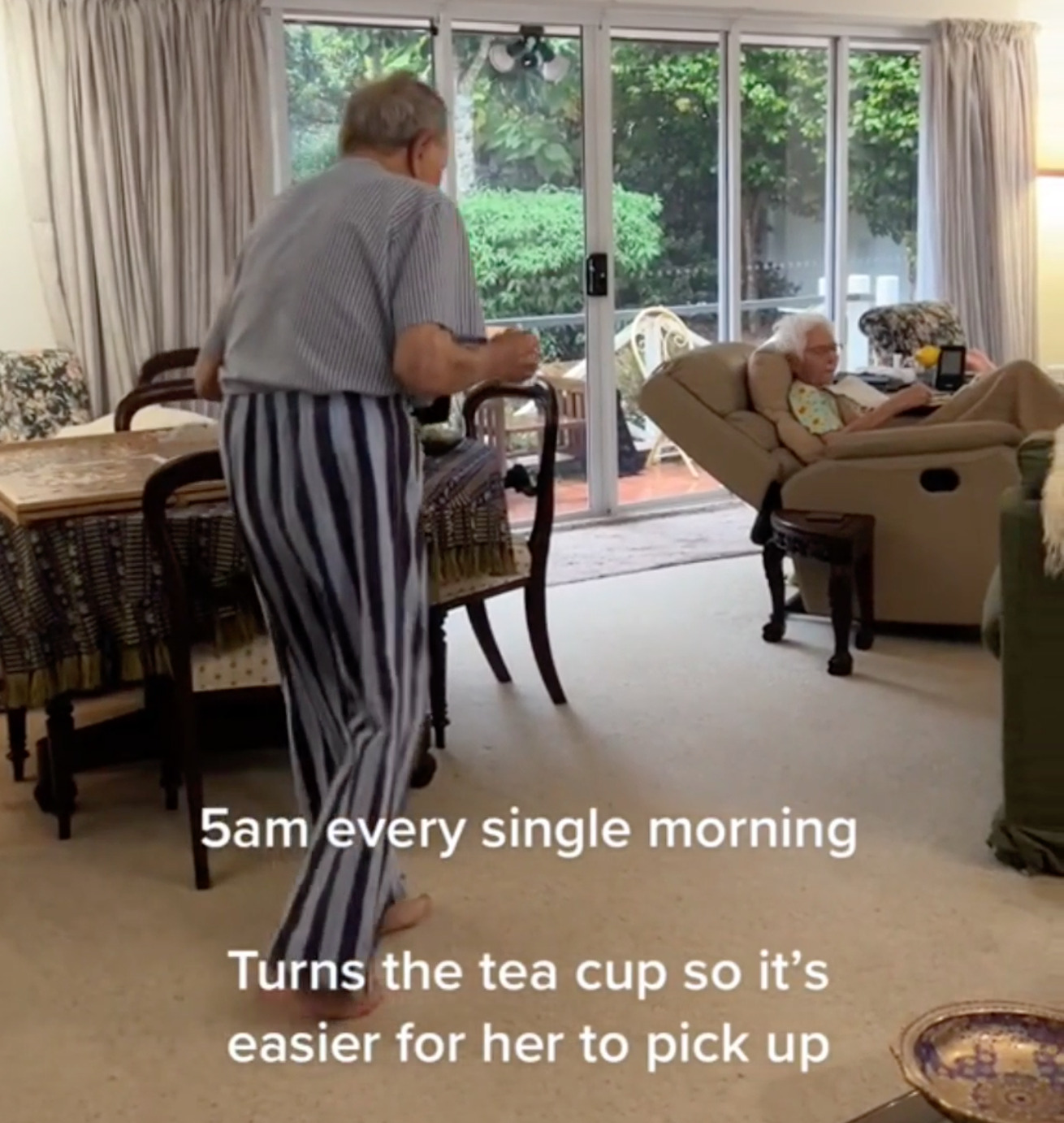 Screenshot of Mr. Hart bringing a cup of tea for Ms. Hart at 5 a.m. every single morning.