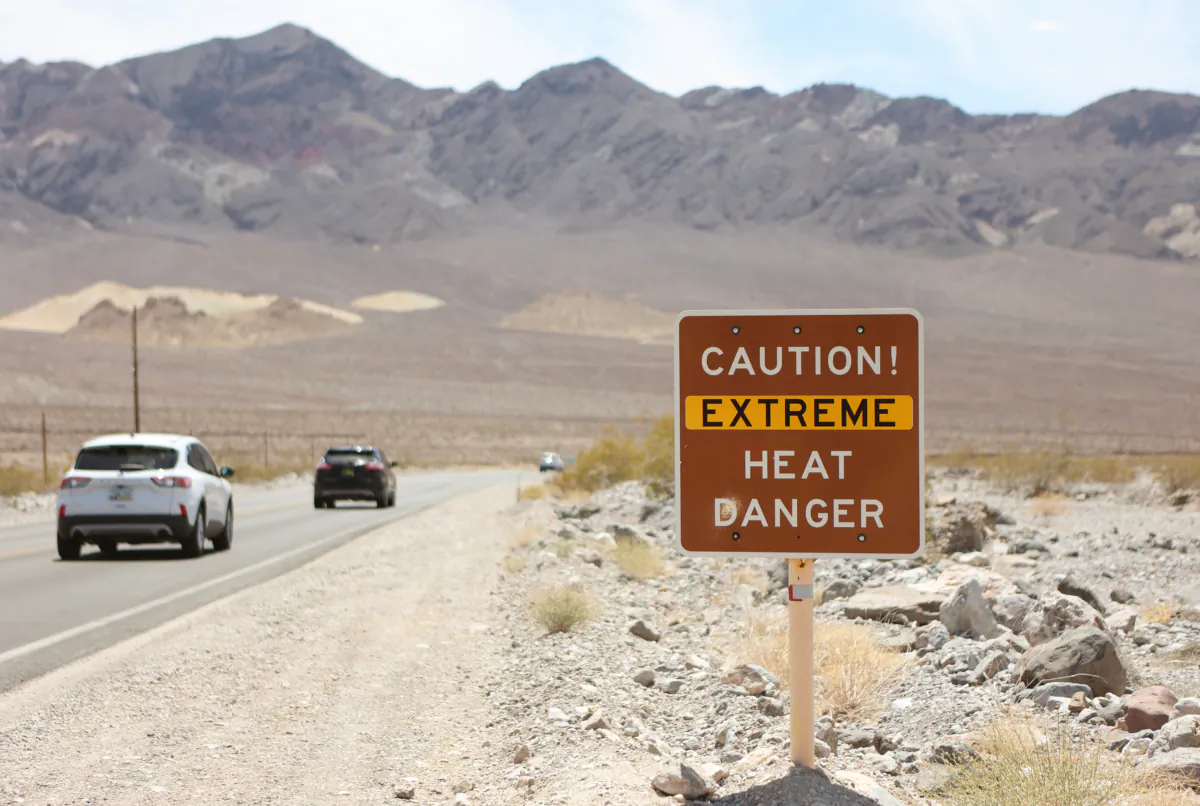 A heat advisory sign is shown along U.S. highway 190 during a heat wave in Death Valley National Park in Death Valley, Calif., on July 16, 2023. (Ronda Churchill/AFP via Getty Images)