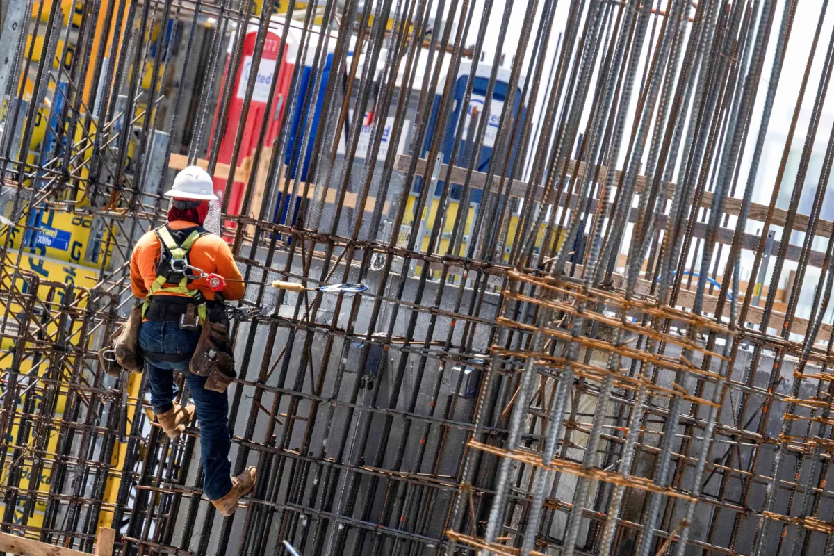 Construction workers erect a building in downtown Miami, Fla., on June 14, 2023. (JIM WATSON/AFP via Getty Images)
