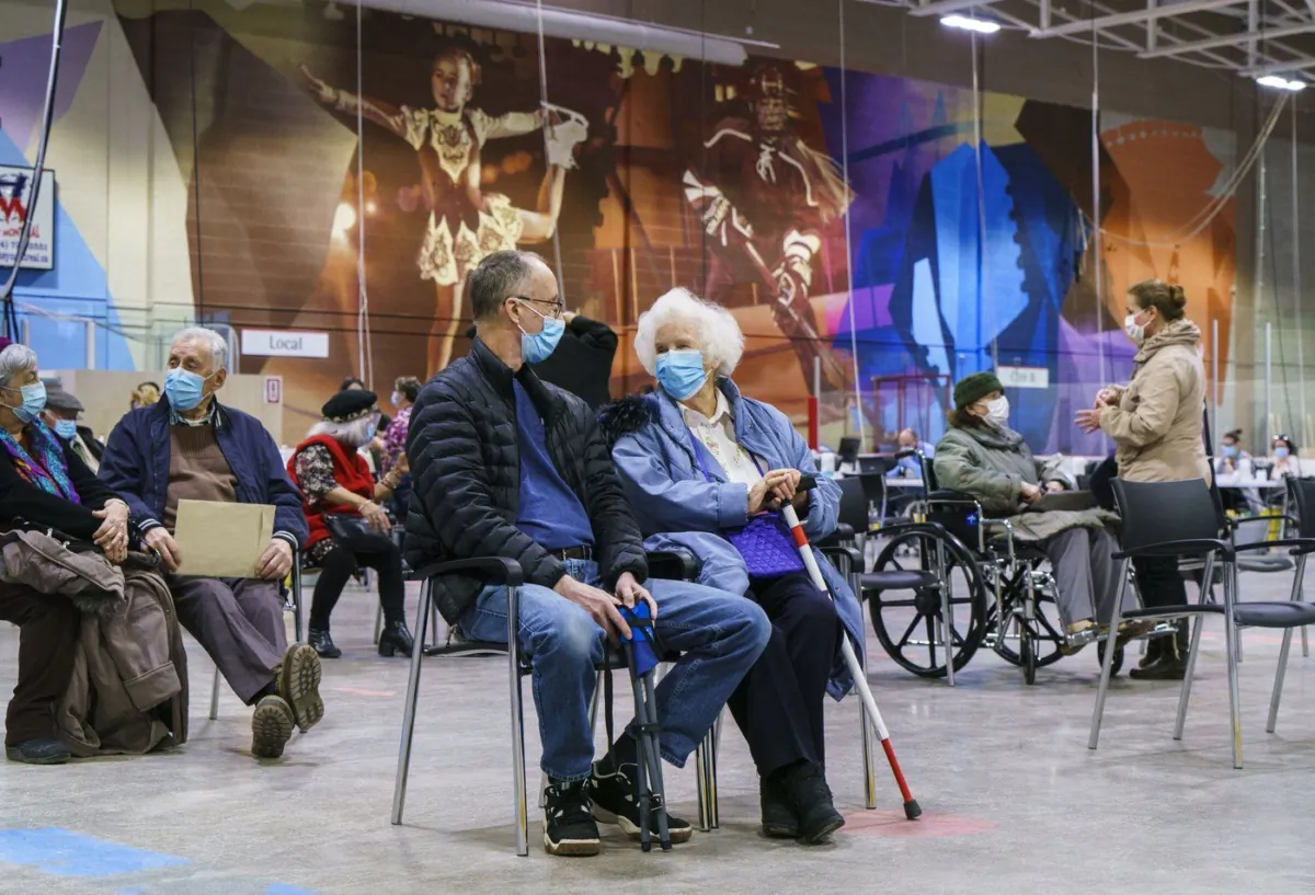 Seniors wait after receiving a first dose of COVID-19 vaccine at a vaccination clinic in Montreal on Mar. 10, 2021. (The Canadian Press/Paul Chiasson)