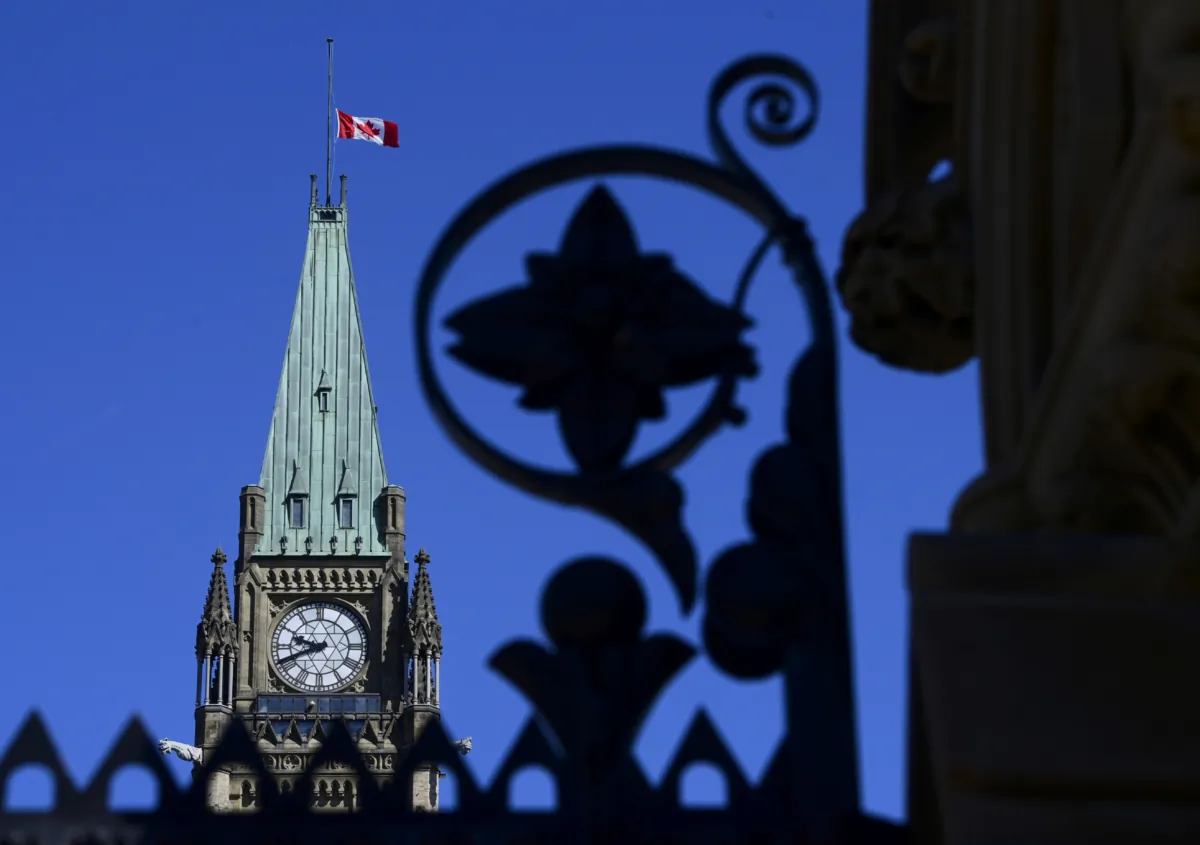 The Canadian flag on the Peace Tower flies at half-mast on Parliament Hill in Ottawa on June 2, 2021, in recognition of the discovery of potential children's graves at the site of a former residential school in Kamloops, B.C. (The Canadian Press/Sean Kilpatrick)