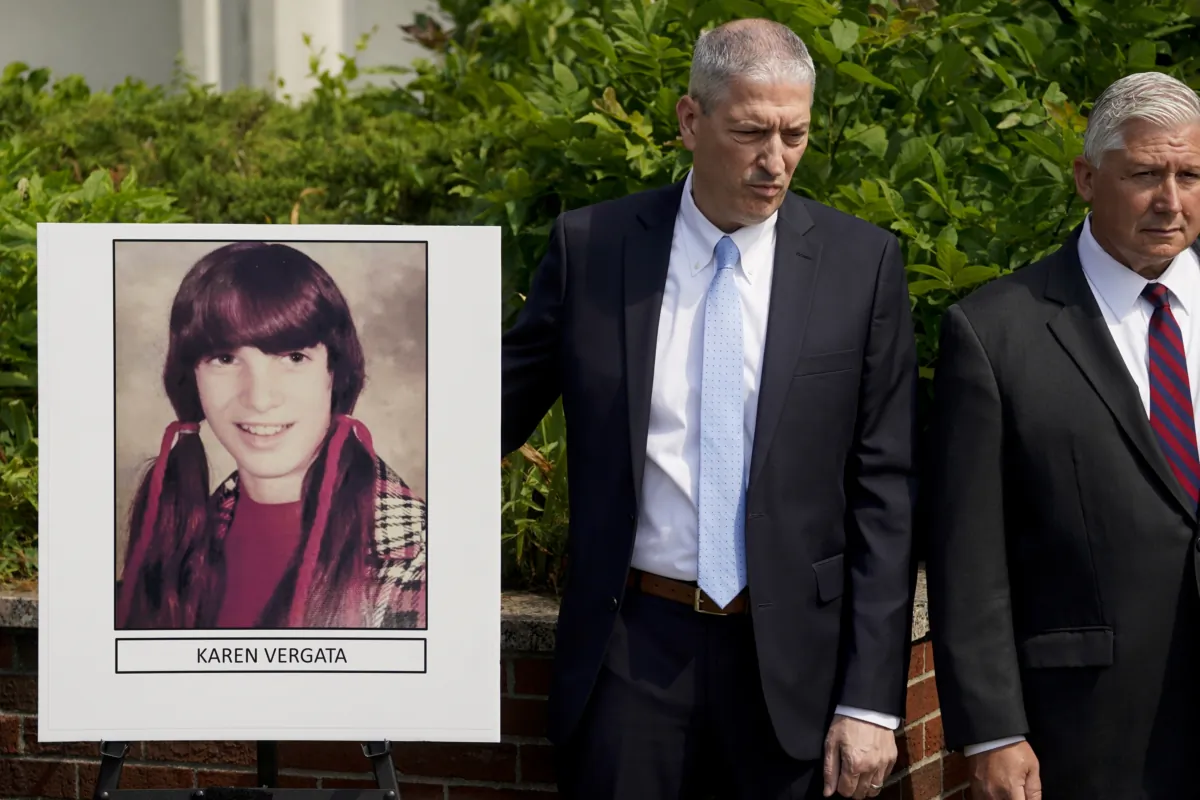 Suffolk County District Attorney Raymond Tierney (unseen) speaks at a news conference to announce the identity of a victim investigators had called the "Jane Doe No. 7," as Karen Vergata (L) in Hauppauge, N.Y., on Aug. 4, 2023. (John Minchillo/AP Photo)