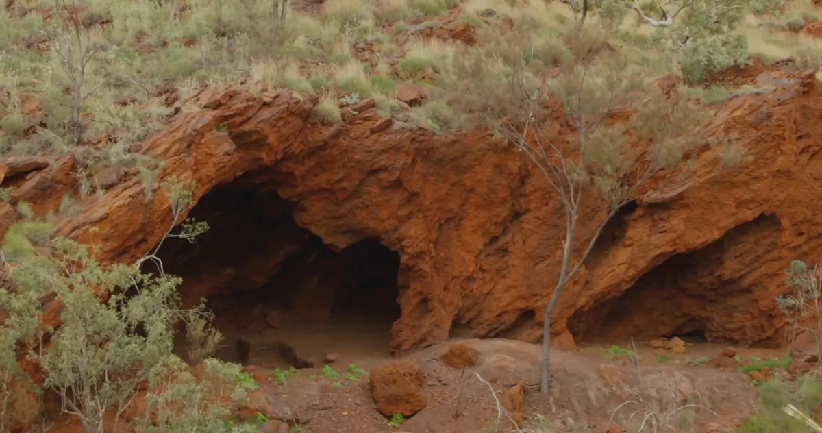 A screenshot of a supplied video taken in 2015 shows the Juukan Gorge rock shelters in Western Australia. The 46,000-year-old caves were destroyed by mining giant Rio Tinto in May 2020, distressing the traditional owners, the Puutu Kunti Kurrama and Pinikura (PKKP) people. (AAP Image/Supplied by PKKP and PKKP Aboriginal Corporation)