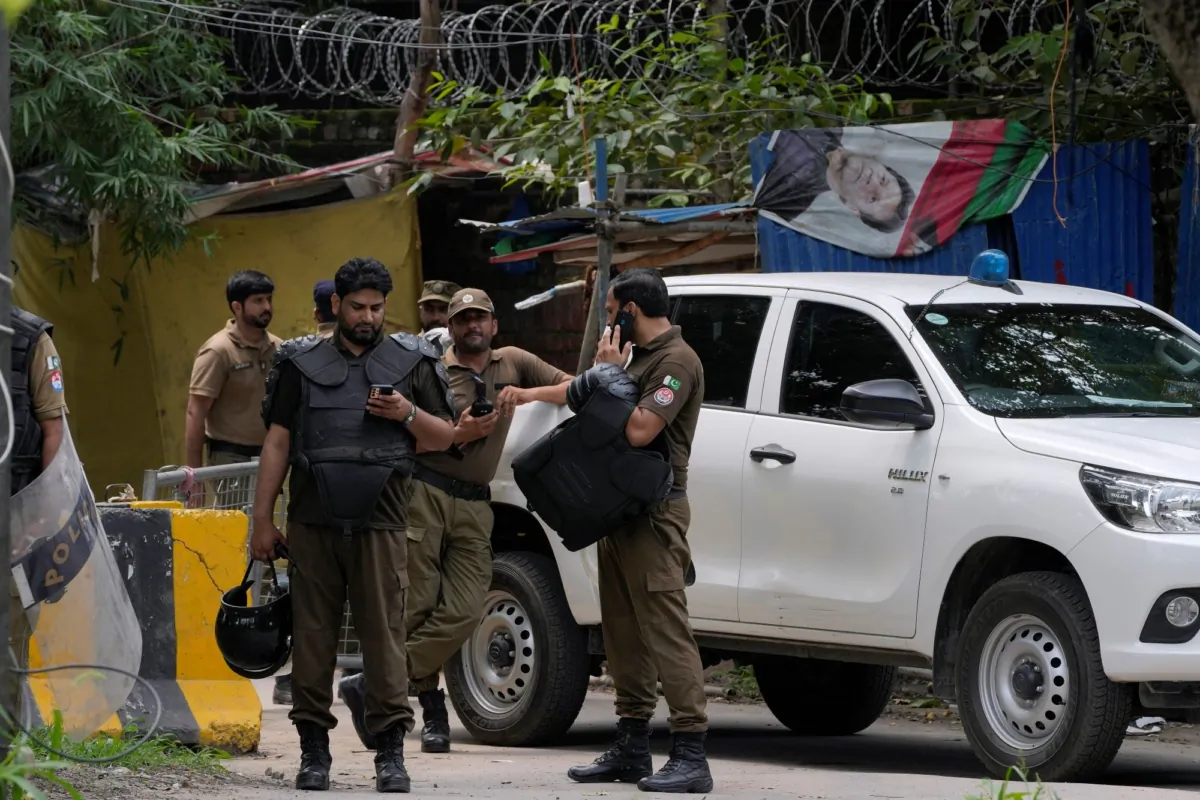 Police officers prepare to take position outside the residence of Pakistan's former Prime Minister Imran Khan, in Lahore, Pakistan, on Aug. 5, 2023. (K.M. Chaudary/AP Photo)