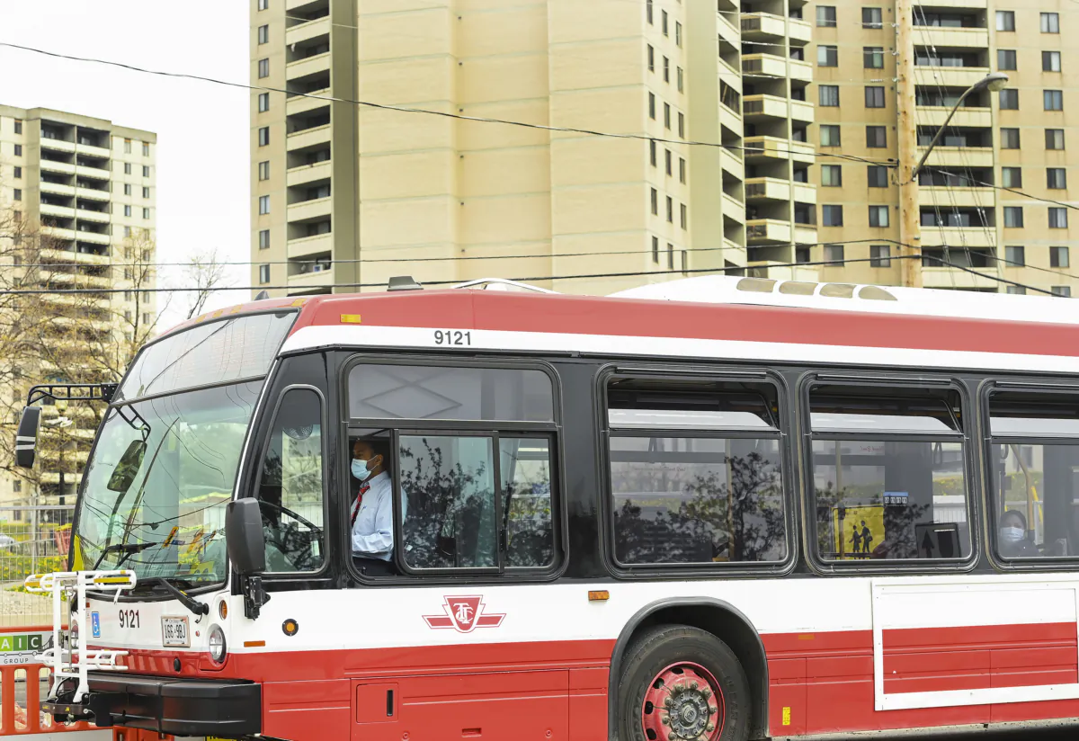 A TTC bus transports people in a Toronto neighbourhood on May 3, 2021. (Nathan Denette/The Canadian Press)