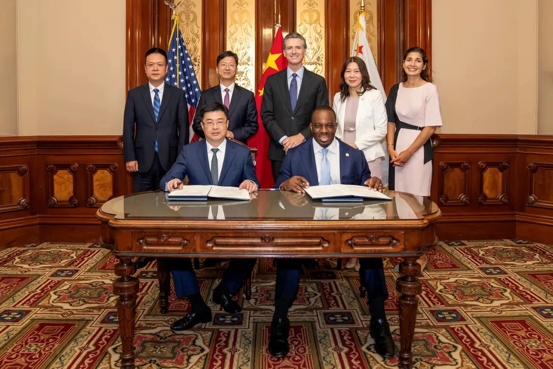 Delegates from both California and China's Hainan Province come together to forge an international climate agreement outlining shared goals and principles related to reducing carbon emissions, in Sacramento, Calif., on Aug. 3, 2023. (Courtesy of Office of Governor Gavin Newsom)