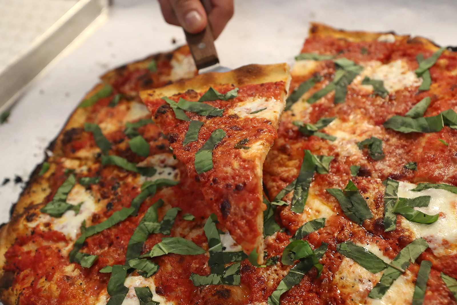 A meatball and ricotta pizza is served at Frank Pepe Pizzeria Napoletana in Delray Beach.