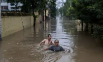 Hong Kong Public Cold to Call From Red Cross to Donate to Northern China’s Flood Relief