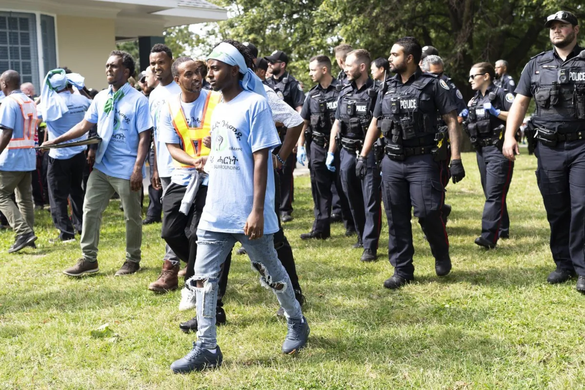 Toronto Police work the scene of a protest that turned violent in Earlscourt Park in Toronto, on Aug. 5, 2023. (The Canadian Press/Arlyn McAdorey)