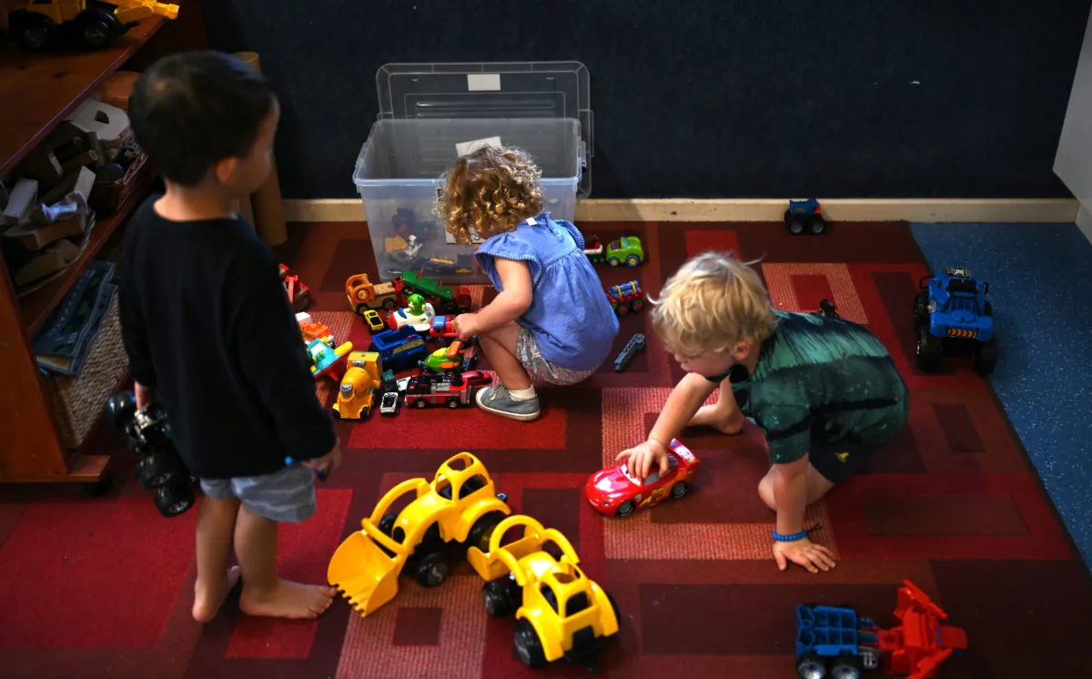 A small group of children play at the Robertson Street Kindy Childcare Centre in Helensburgh south of Sydney, Australia, on April 3, 2020. (AAP Image/Dean Lewins)