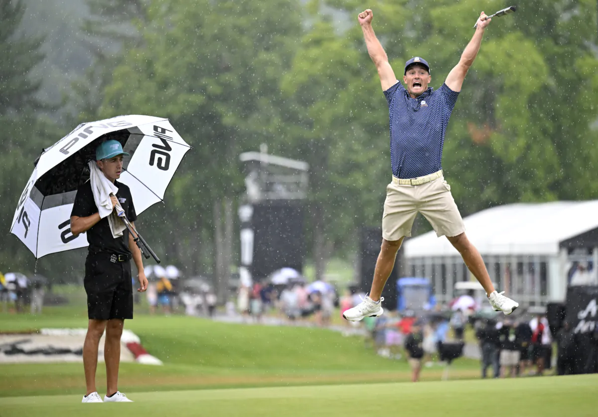 Bryson DeChambeau of the United States celebrates his birdie putt on the 18th hole with a record 58 to win the LIV Golf Invitational—Greenbrier at The Old White Course in White Sulphur Springs, W.V., on August 6, 2023. (Eakin Howard/Getty Images)