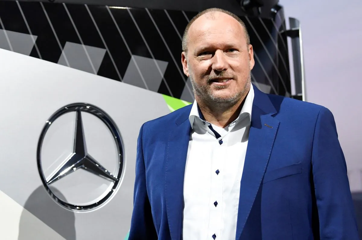 CFO of Daimler Truck Holding AG Jochen Goetz stand for a picture in front of a truck at the annual general meeting of Daimler Truck Holding AG in Stuttgart, southern Germany, on June 21, 2023. (Thomas Kienzle/AFP via Getty Images)