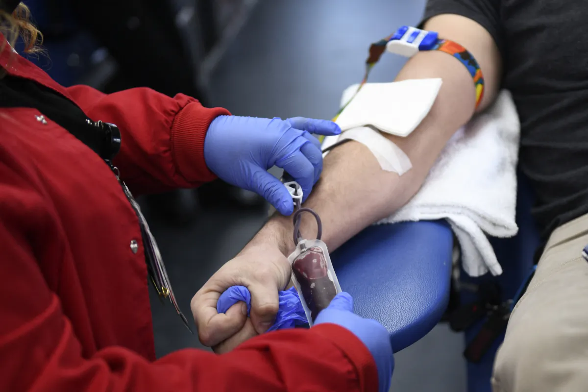 A person donates blood in Los Angeles on Jan. 13, 2022. (Patrick T. Fallon/AFP via Getty Images)