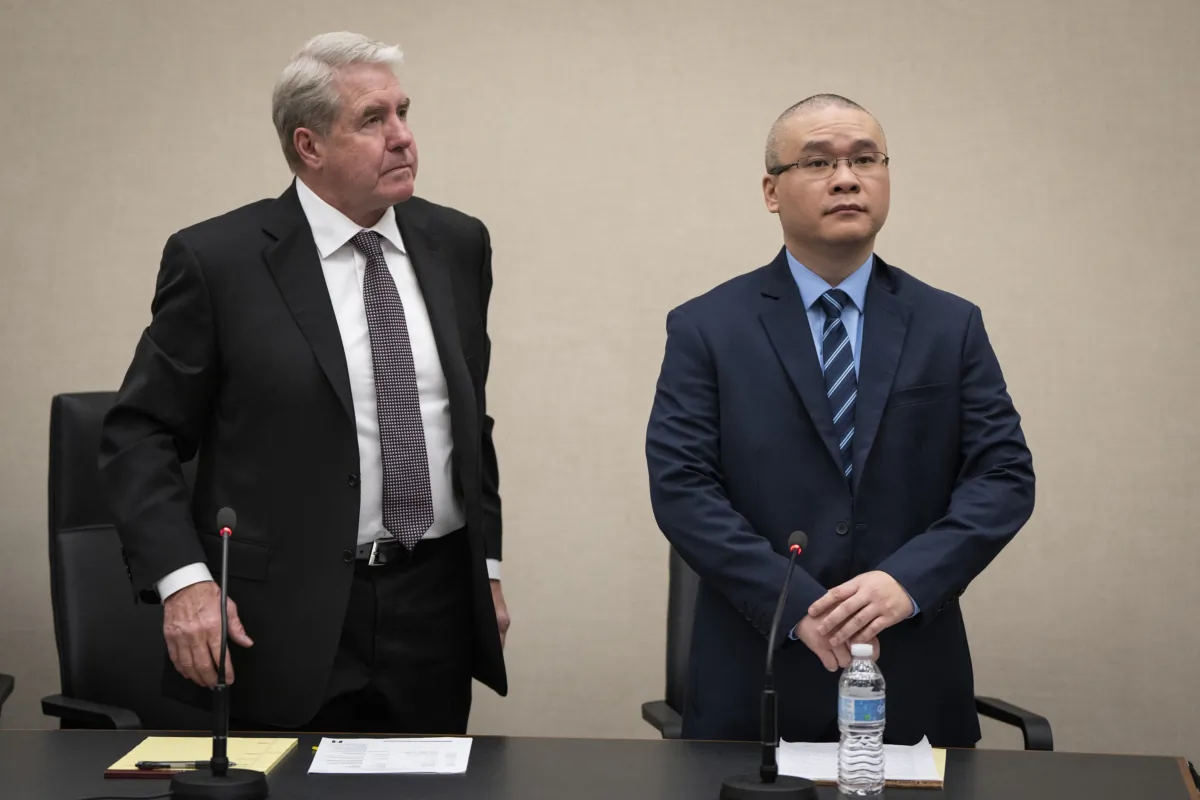 Tou Thao (R) stands with his defense attorney Robert Paule during his sentencing hearing in Hennepin County District Court in Minneapolis, Minn., on Aug. 7, 2023. (Leila Navidi/Star Tribune via AP)