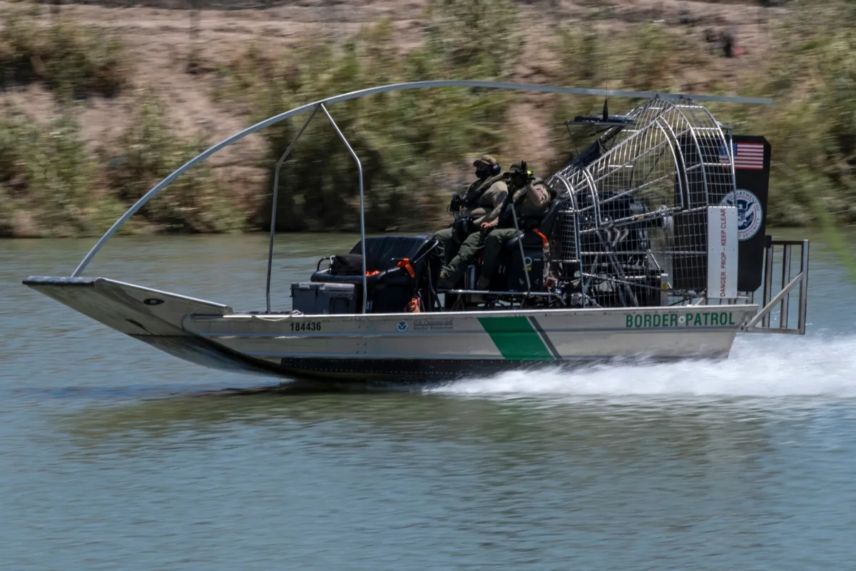 A border patrol boat navigates through the Grand River in Eagle Pass, Texas, as seen from Piedras Negras, Coahuila state, Mexico, on Aug. 4, 2023. (Guillermo Arias/AFP via Getty Images)