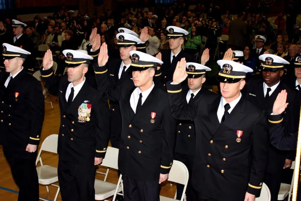 Officer candidates take the oath of office during a commissioning ceremony following graduation from Officer Candidate School at Naval Station Newport. (Gregg Kohlweiss/U.S. Navy) 