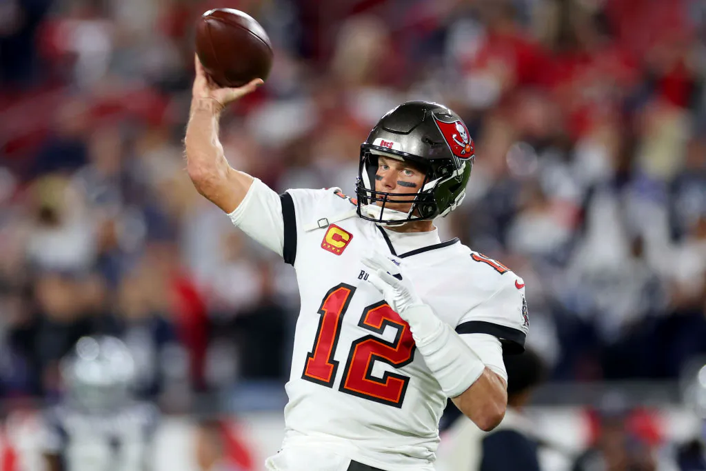 Tom Brady (12) of the Tampa Bay Buccaneers warms up prior to a game against the Dallas Cowboys in the NFC Wild Card playoff game at Raymond James Stadium in Tampa, Fla., on Jan. 16, 2023. (Mike Ehrmann/Getty Images)