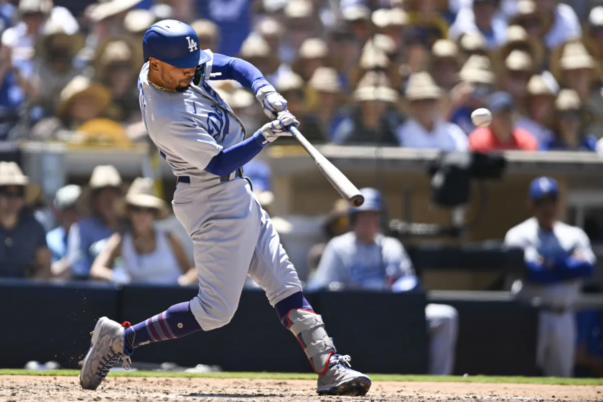 Mookie Betts (50) of the Los Angeles Dodgers hits a grand slam during the fourth inning of a baseball game against the San Diego Padres at Petco Park in San Diego on August 7, 2023. (Denis Poroy/Getty Images)