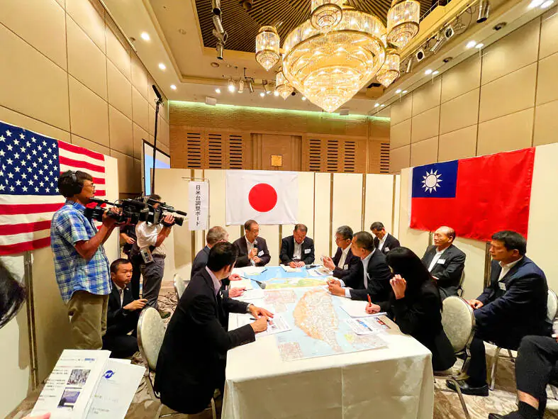 Representatives from Taiwan, Japan, and the United States take part in tabletop war games organized by the Japan Forum for Strategic Studies in Tokyo on July 16. (Courtesy of Taiwan's Central News Agency)