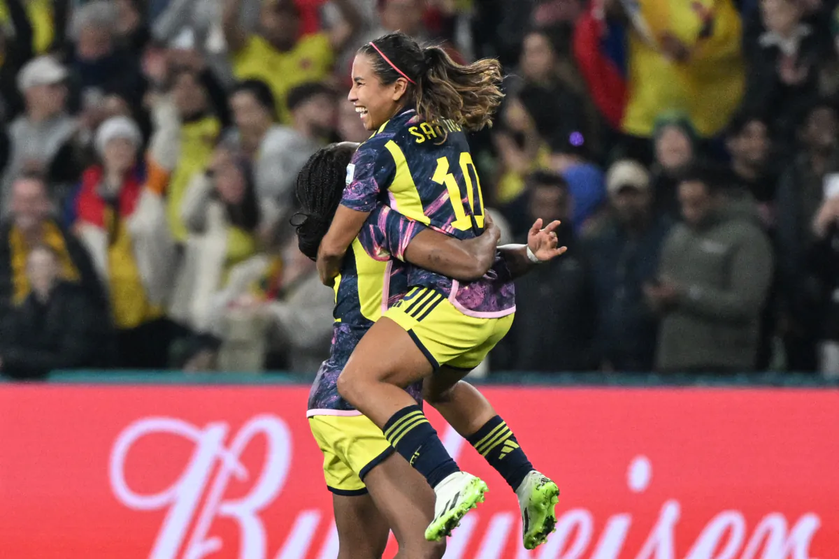 Colombia's forward #10 Leicy Santos (R) celebrates at the end of the Australia and New Zealand 2023 Women's World Cup round of 16 soccer match between Jamaica and Colombia at Melbourne Rectangular Stadium, also known as AAMI Park, in Melbourne, Australia, on Aug. 8, 2023. (William West/AFP via Getty Images)