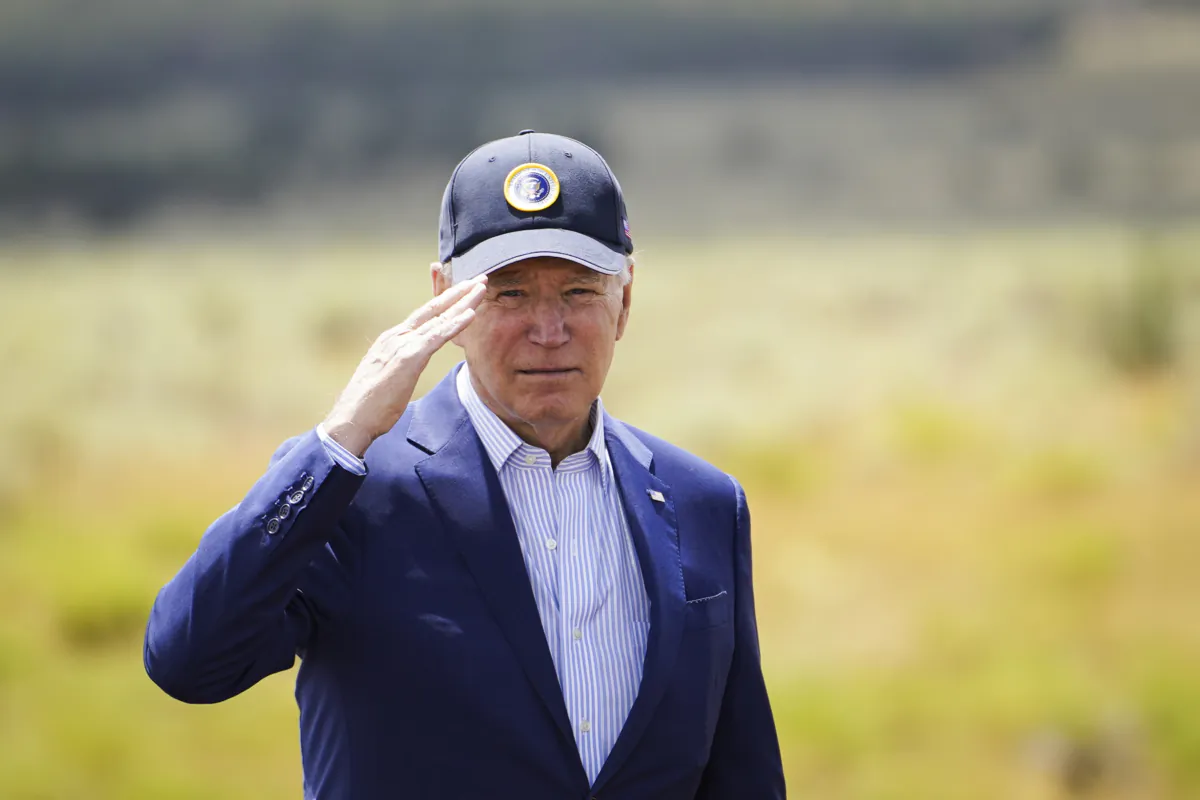 President Joe Biden salutes the audience after speaking about investments in conservation and protecting natural resources at Red Butte Airfield, Ariz., on Aug. 8, 2023. (Madalina Vasiliu/The Epoch Times)