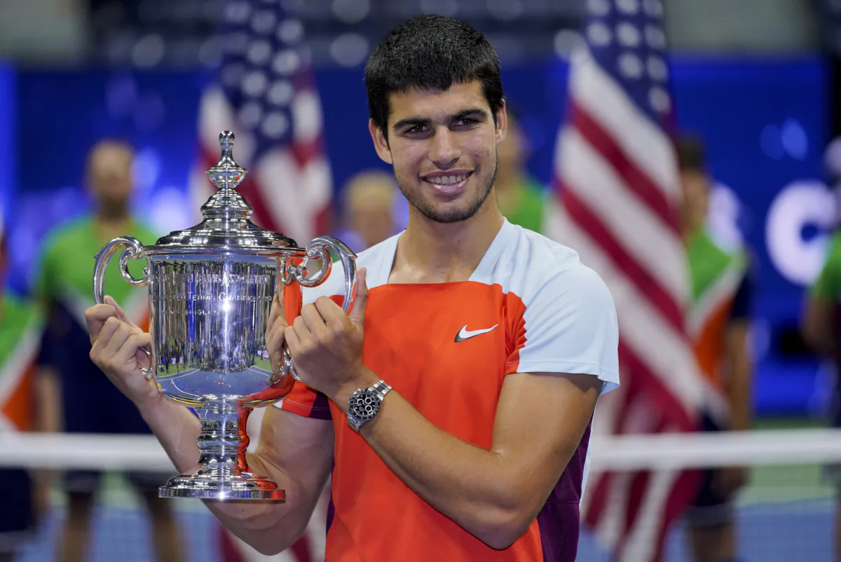 Carlos Alcaraz, of Spain, holds up the championship trophy after defeating Casper Ruud, of Norway, in the men's singles final of the U.S. Open tennis championships in New York on Sept. 11, 2022. (Charles Krupa, AP Photo)