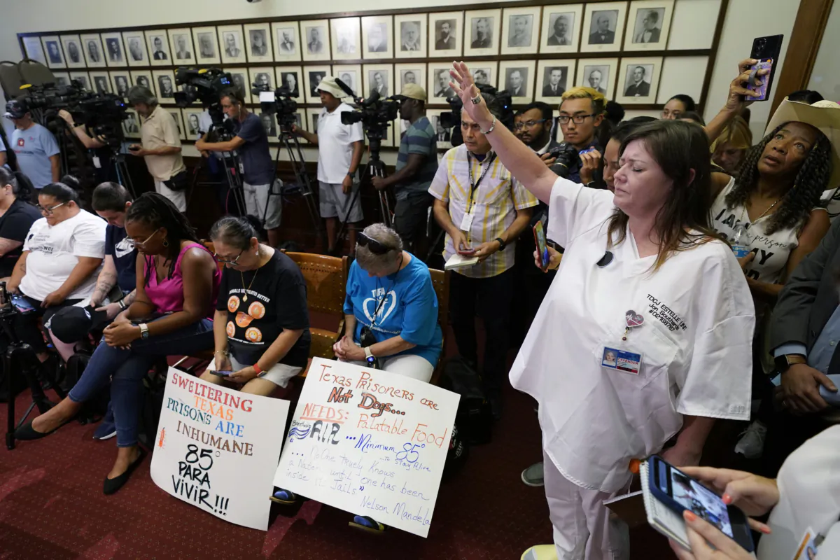 Advocates for cooling Texas prisons pray during a news conference at the Texas Capitol in Austin, Texas, on July 18, 2023. (Eric Gay/AP Photo)