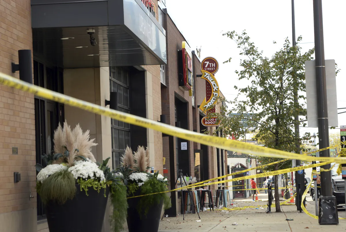 Crime scene tape surrounds the scene after an early morning shooting at the Seventh Street Truck Park in St. Paul, Minn., on Oct. 10, 2021. (Scott Takushi/Pioneer Press via AP)