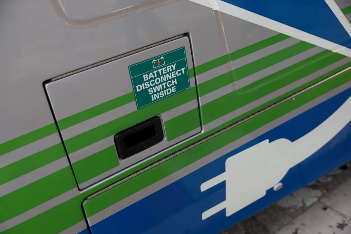 A door covers the plug where a Proterra-made battery-powered electric bus is charged, in Miami, Fla., on Feb. 02, 2023. (Joe Raedle/Getty Images)