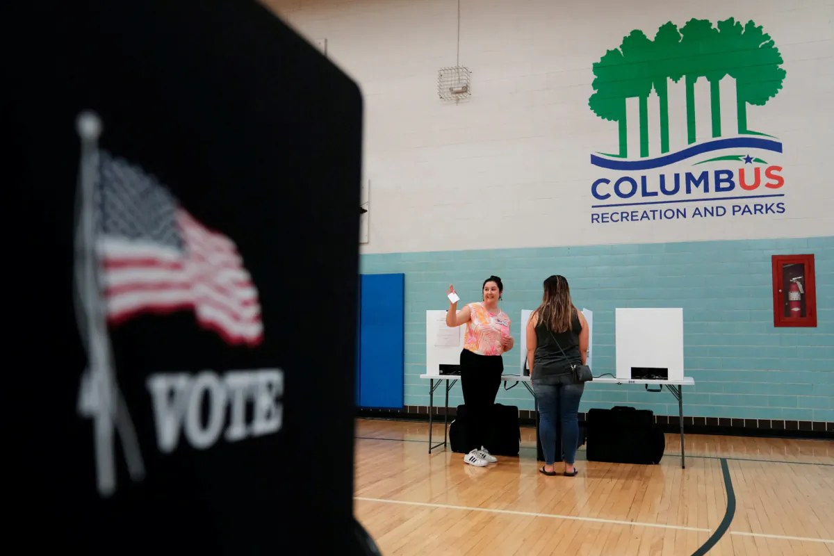 Volunteer Amelia Klein helps voters  during a special election for the earlier Issue 1 at the  German Village in Columbus, Ohio, on Aug. 8, 2023.   (Adam Cairns/USA Today Network via Reuters)