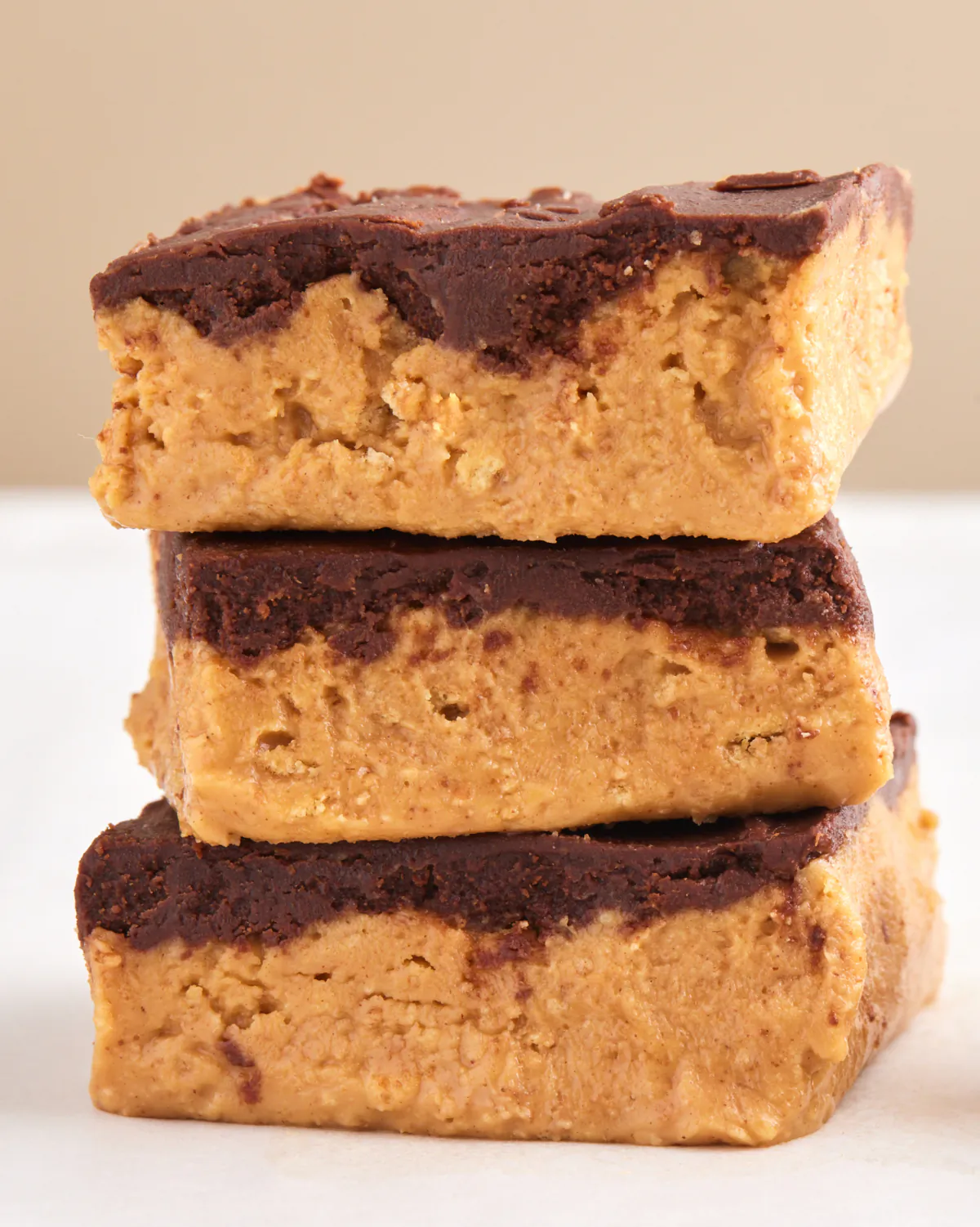 These five-ingredient peanut butter bars have a rich chocolate topping. (Lucy Schaeffer/TNS)