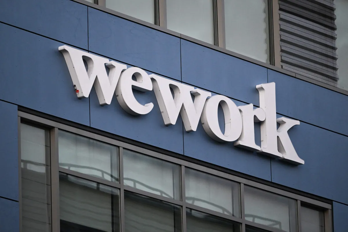 The WeWork logo is displayed outside of a shared commercial office space building in Los Angeles on Aug. 8, 2023. (Patrick T. Fallon/AFP via Getty Images)