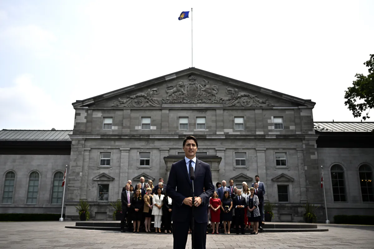 Members of the federal cabinet stand behind Prime Minister Justin Trudeau as he speaks at a media availability after a cabinet shuffle at Rideau Hall in Ottawa on July 26, 2023. (Justin Tang/The Canadian Press)