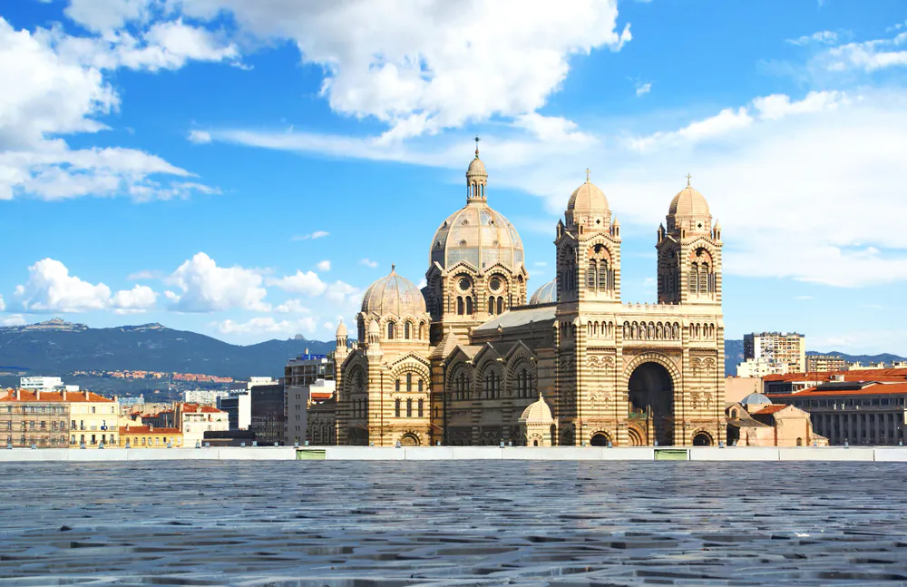 Located in the 2nd district of Marseille and standing next to the old port, Marseille Cathedral is an impressive sight as viewed from the sea. The use of different shades of stone and marble set the cathedral apart from other churches of the era. Rather than following the Byzantine architectural tradition, it follows the 19th-century historicism style, an eclectic revival of past styles. (Lamax/Shutterstock)