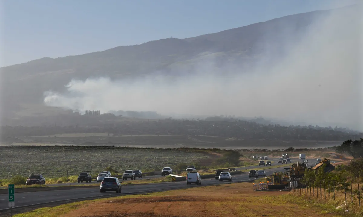 Smoke blows across the slope of Haleakala volcano on Maui, Hawaii, as a fire burns in Maui's upcountry region on Aug. 8. 2023. (Matthew Thayer/The Maui News via AP)