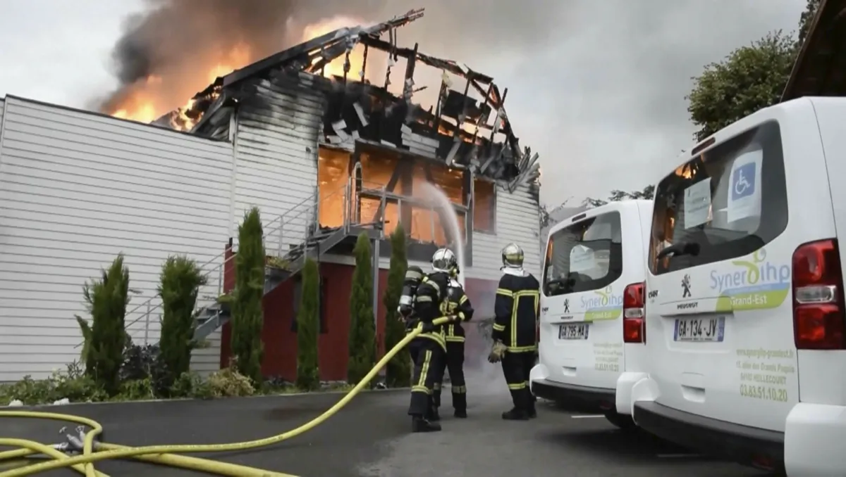Firefighters try to contain the blaze at a vacation home in the town of Wintzenheim, north-eastern France, on Aug. 9, 2023. (TNN/dpa via AP)