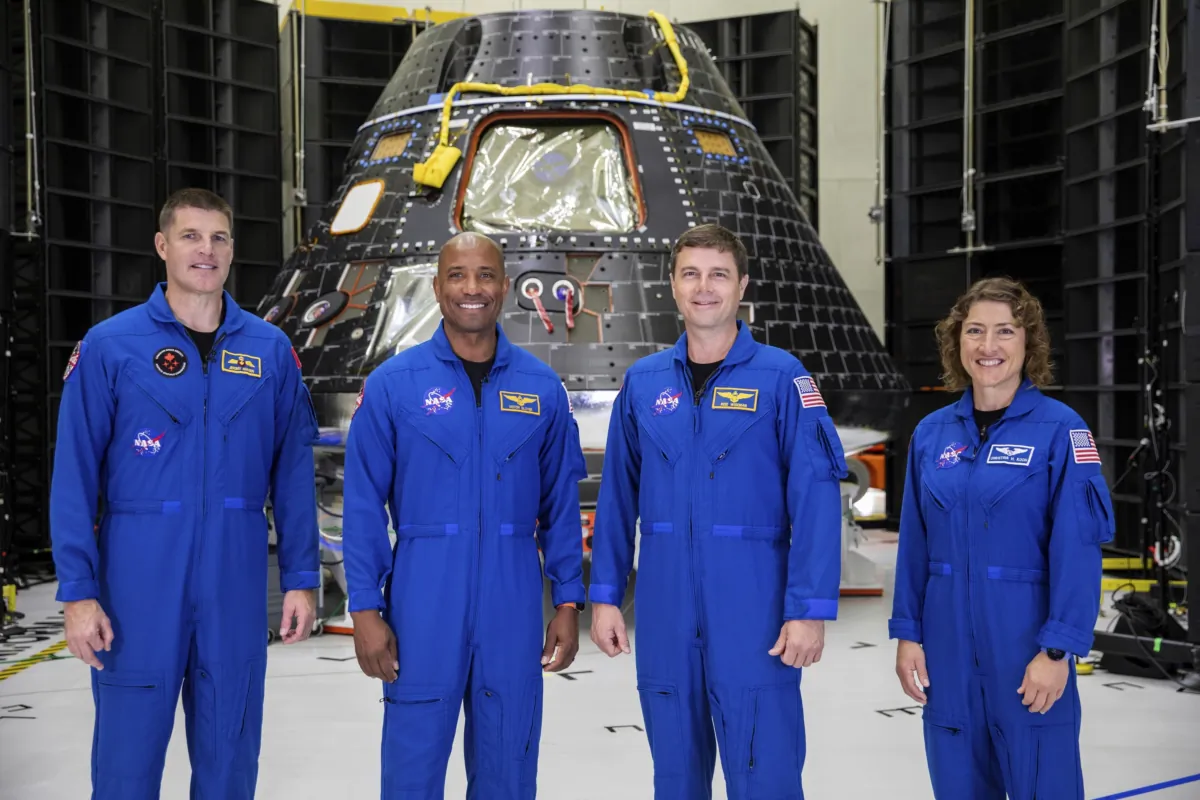 (L–R) Artemis II crew members Jeremy Hansen, Victor Glover, Reid Wiseman, and Christina Koch stand together at NASA's Kennedy Space Center in Florida on Aug. 8, 2023. (Kim Shiflett/NASA via AP)