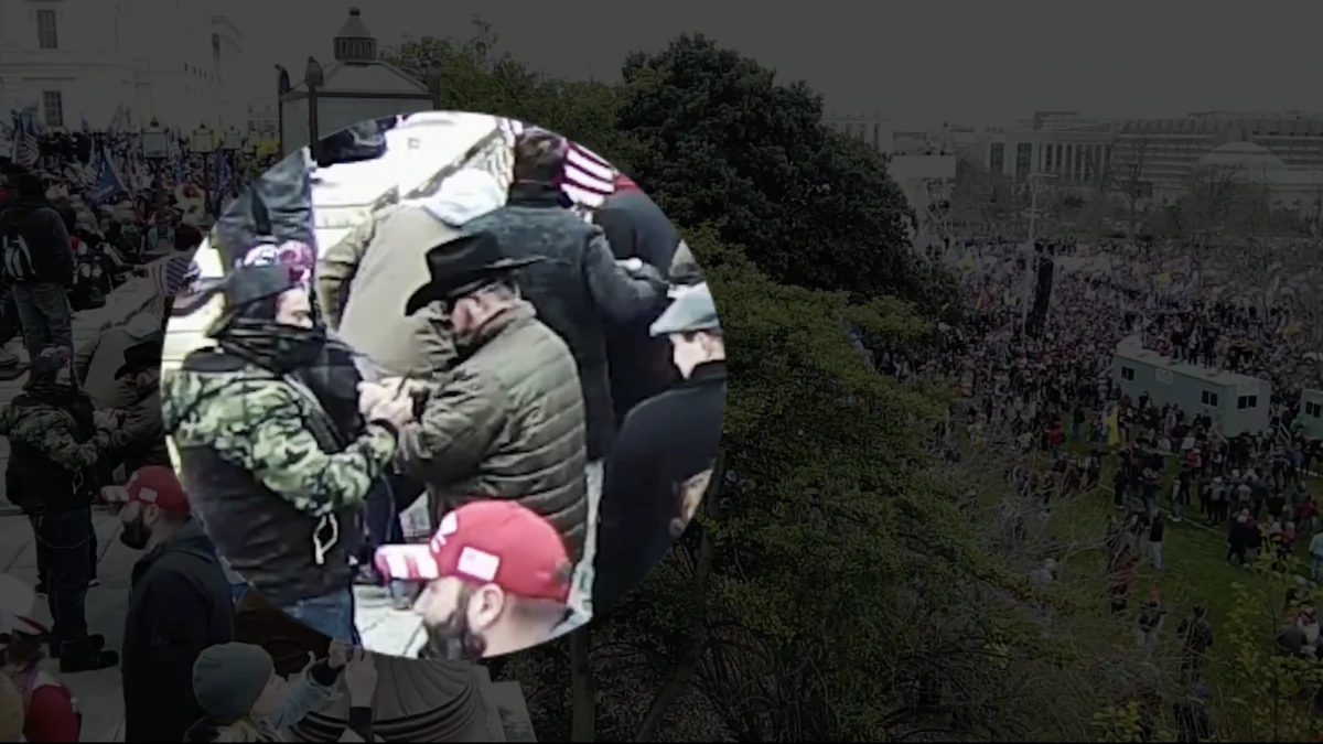 Oath Keepers founder Elmer Stewart Rhodes III attempts a phone call on the upper terrace at the U.S. Capitol on Jan. 6, 2021, as shown in newly disclosed security video. (U.S. Capitol Police/Screenshot via The Epoch Times)