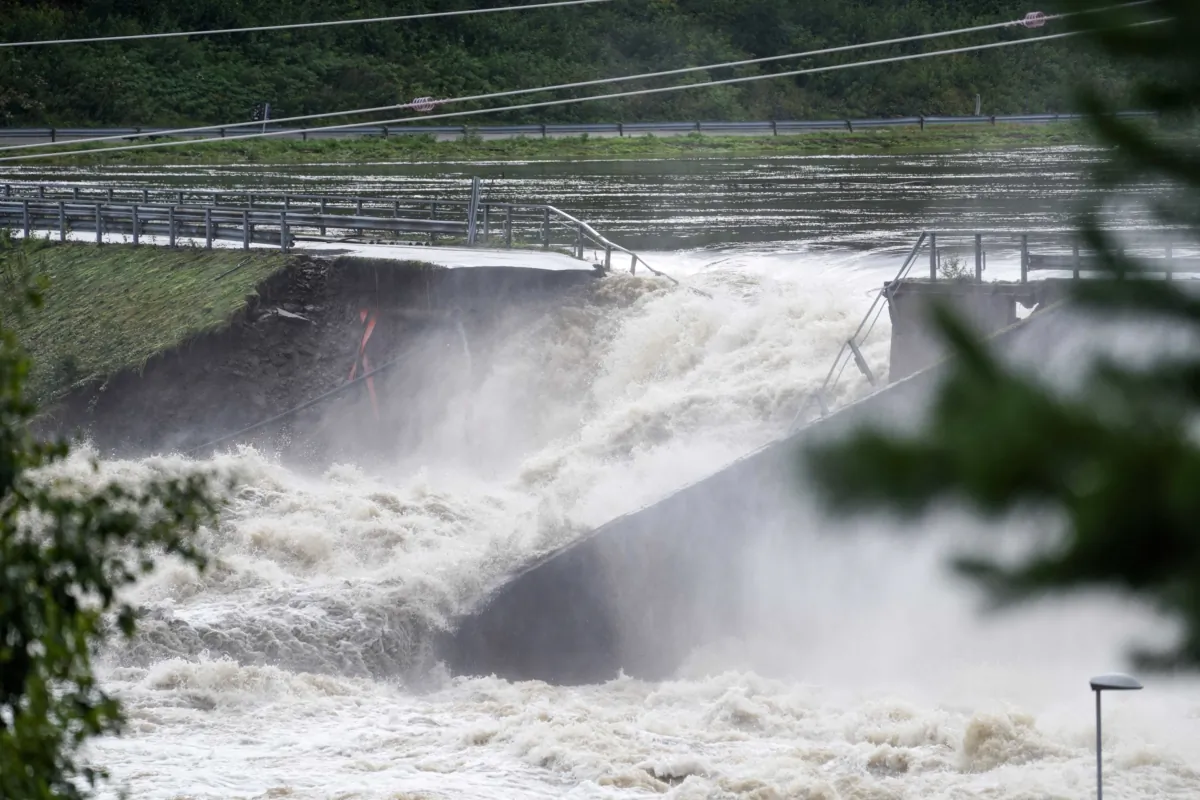 Water breaks through the dam at Braskereidfoss, Norway, on Aug. 9, 2023. (Cornelius Poppe/NTB Scanpix via AP)