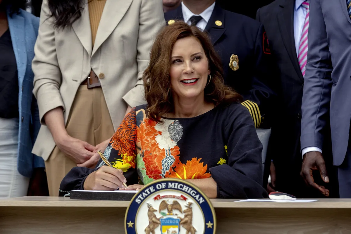 Michigan Gov. Gretchen Whitmer signs the largest state budget in Michigan's history, in Wyandotte, Mich., on July 31, 2023. (Jake May/MLive.com/The Flint Journal via AP)