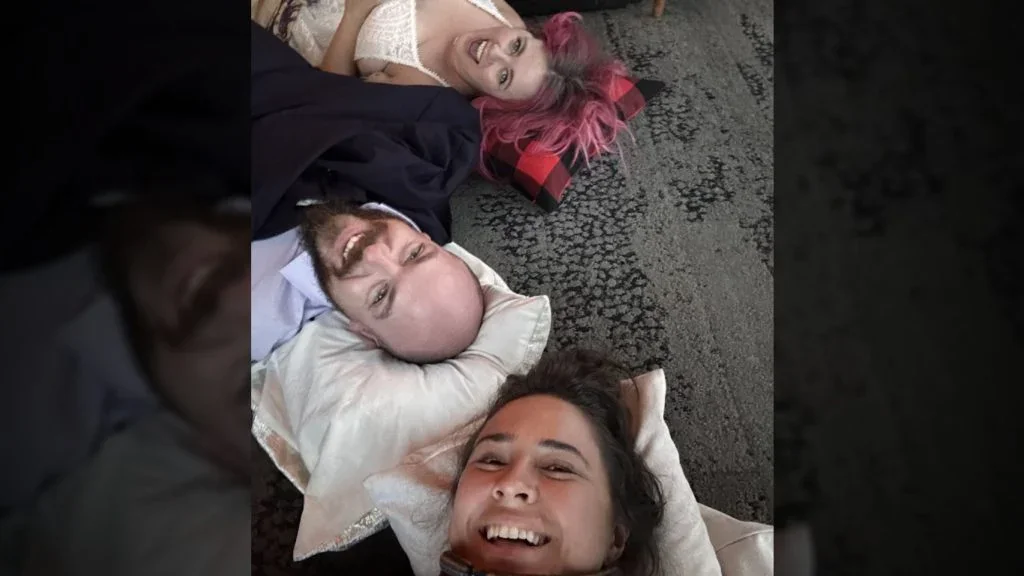 A couple from Kelowna, B.C., had just finished having their wedding photos taken at the top of Sulphur Mountain on Monday when the gondola broke down. Jaclyn, top and Brennen McConnell, middle, had eloped earlier that day before having their photos taken by Pala Kovacs. (The Canadian Press/HO-Pala Kovacs)