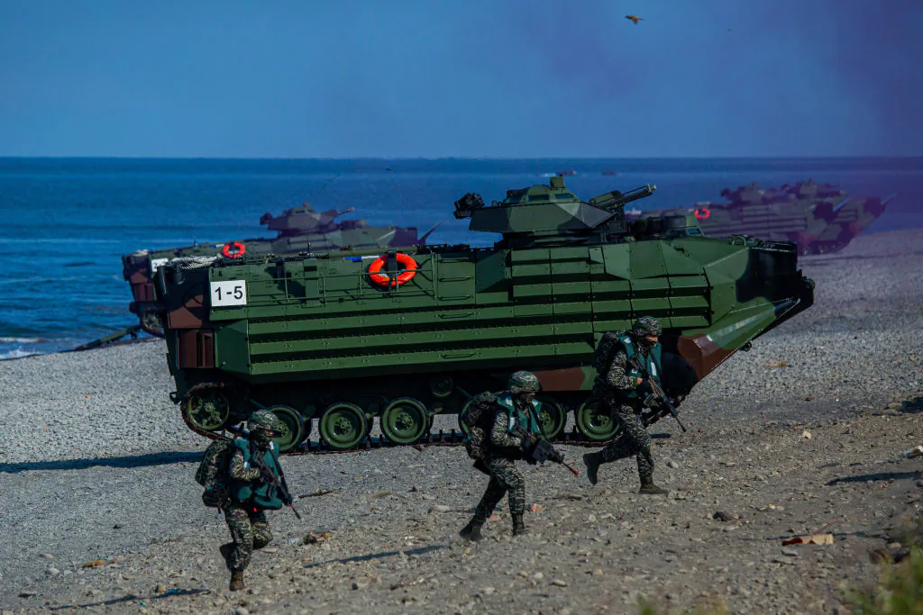 Soldiers disembark from AAV7 amphibious assault vehicles during the Han Kuang military exercise, simulating a PLA invasion of the island, in Pingtung, Taiwan, on July 28, 2022. (Annabelle Chih/Getty Images)